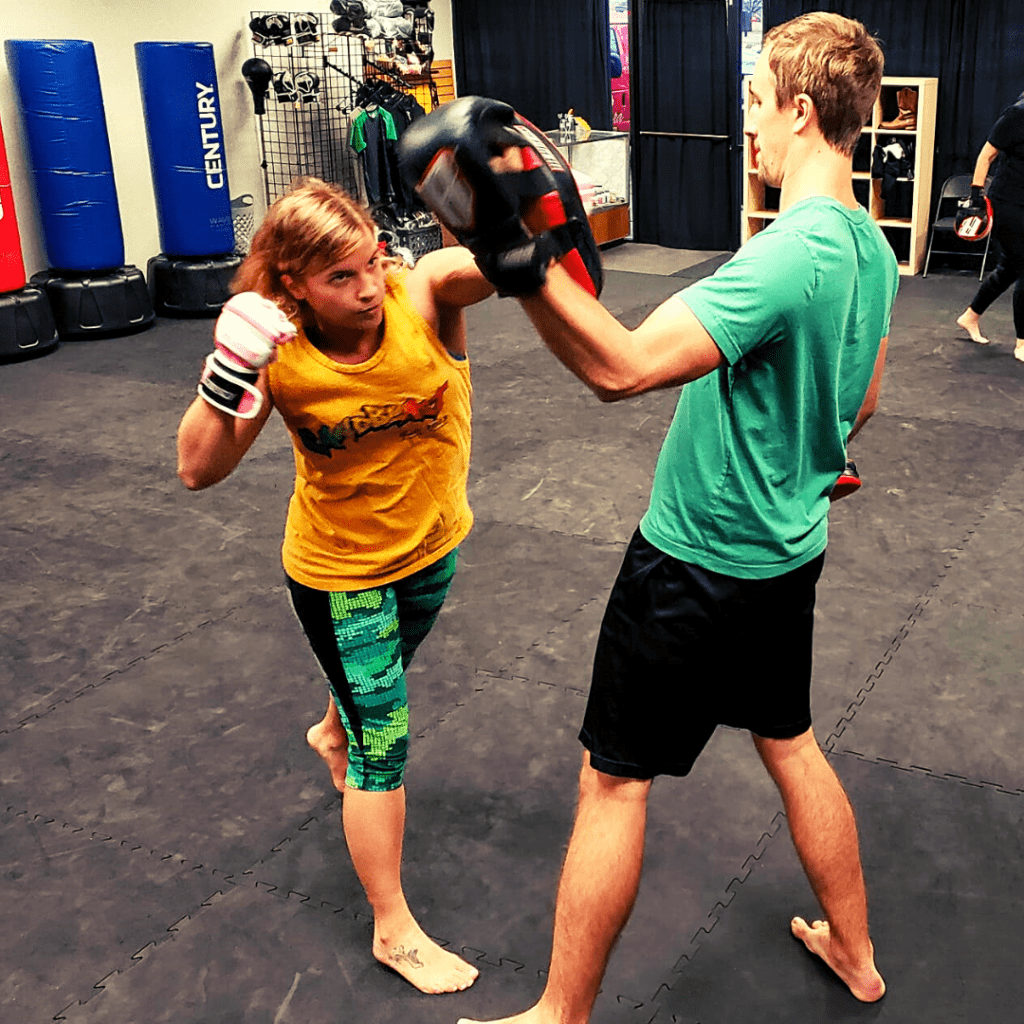 Overhand punch from a female member of our Austin Kickboxing class